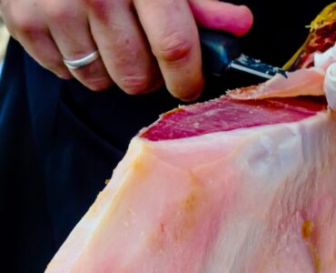 professional slicing jamon serrano, traditional Spanish ham, meat